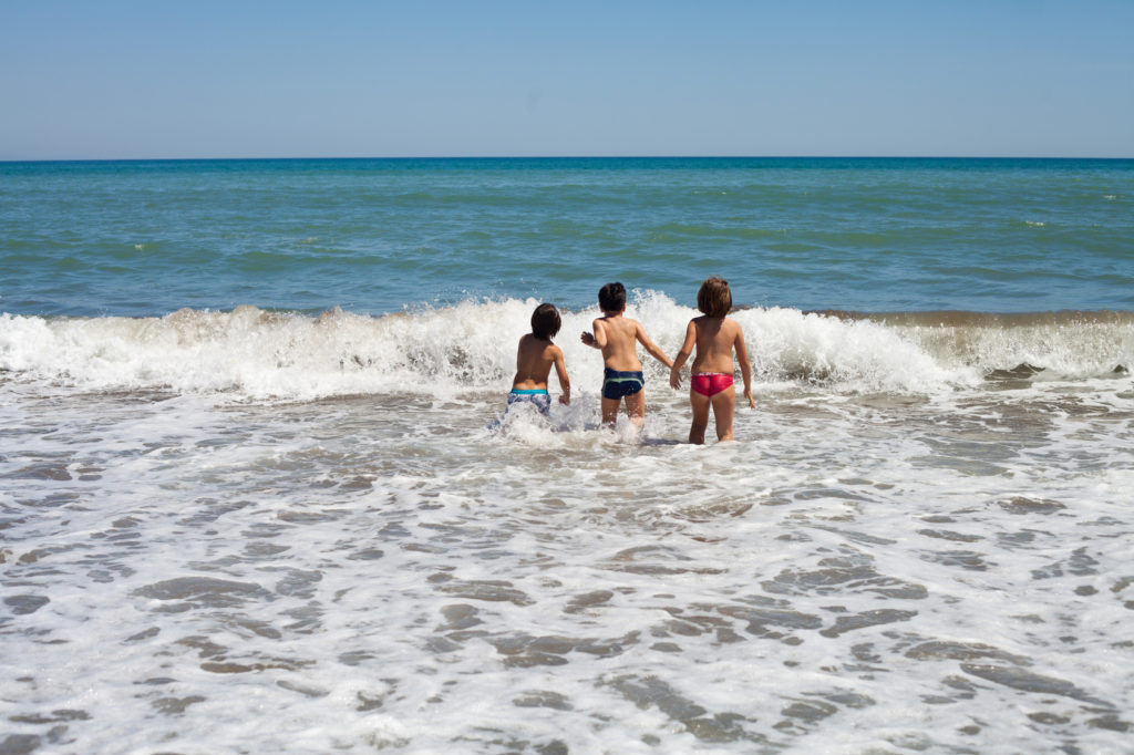 Kids playing in sea
