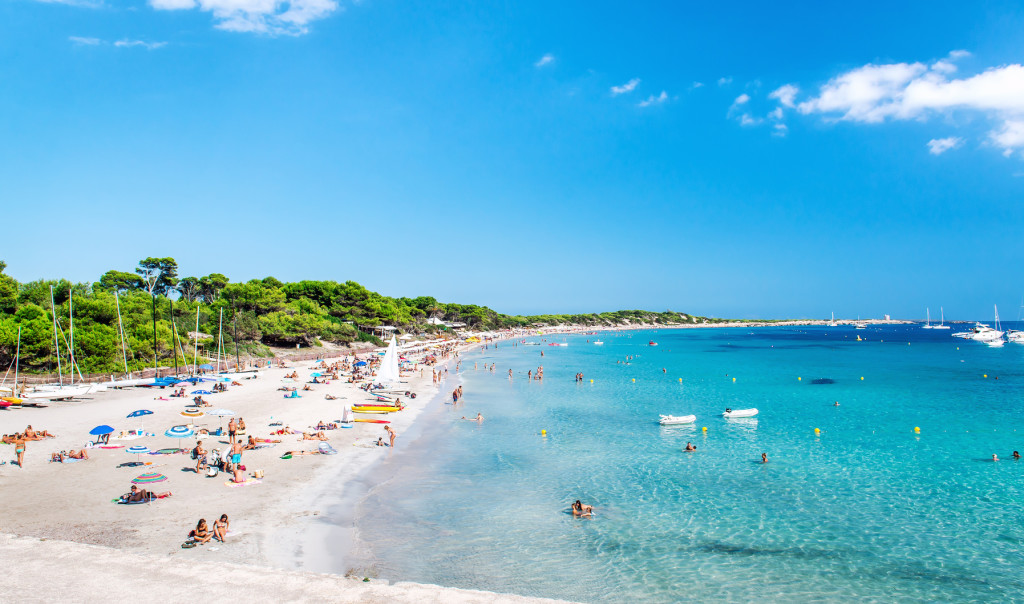 Ibiza, Spain- September 21, 2013: People swimming and sunbathing on the picturesque Las Salinas beach. Ibiza, Balearic islands. Spain