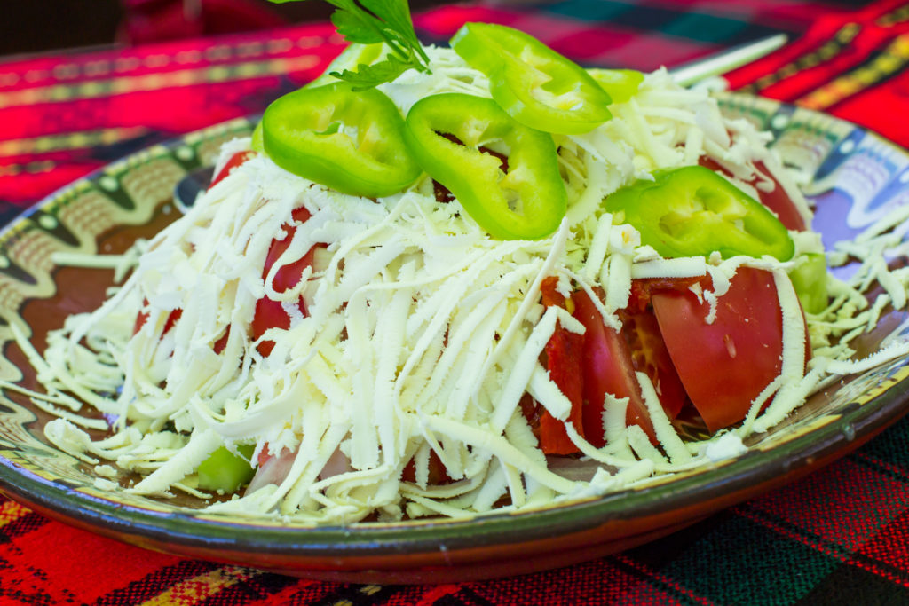 Bulgarian Shopsky Salad made of tomatoes, cucumbers and cheese