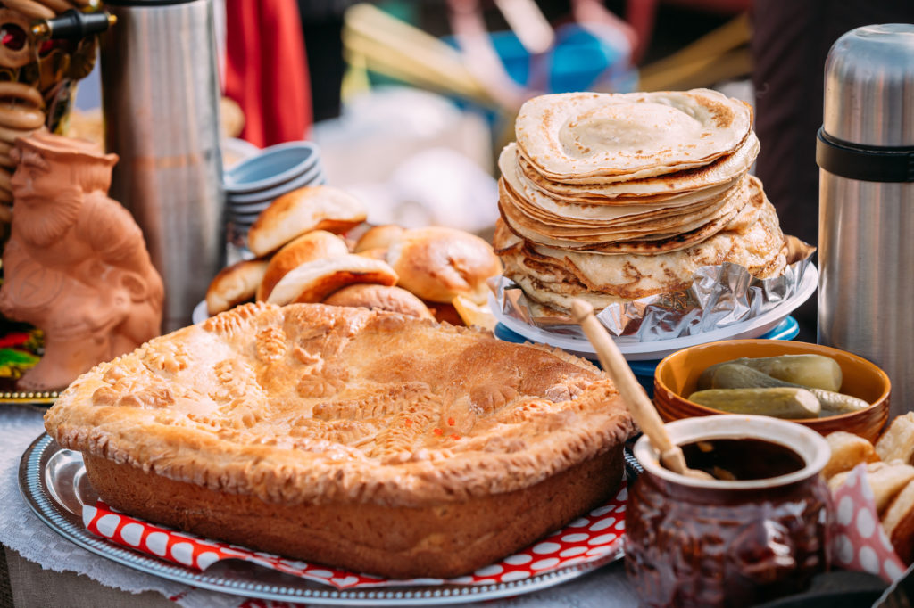 Dishes of the traditional Belarusian cuisine - pie, pancakes and