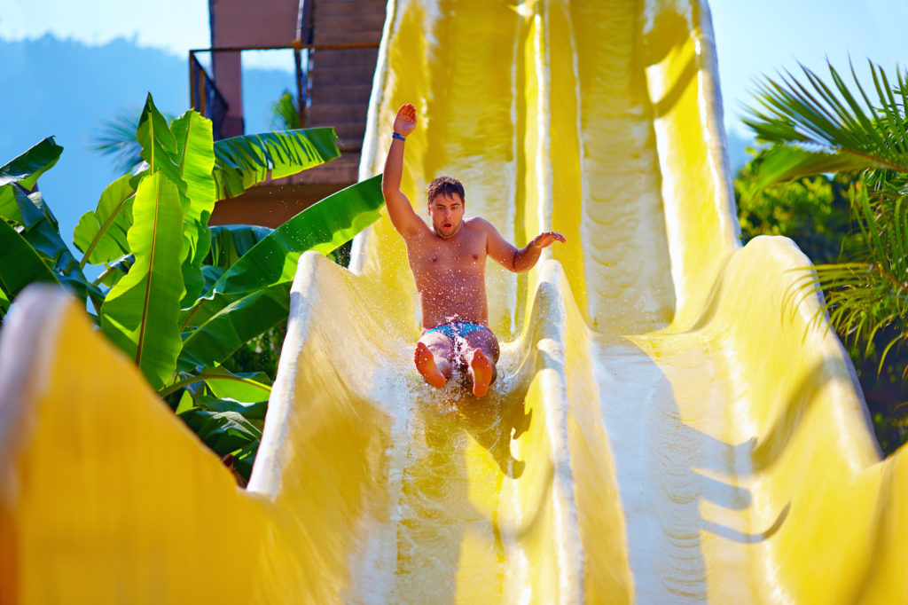 Teen on water slide