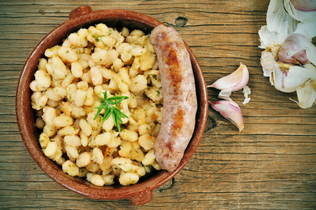 botifarra amb mongetes, fried white beans and sausage typical of Catalonia, Spain