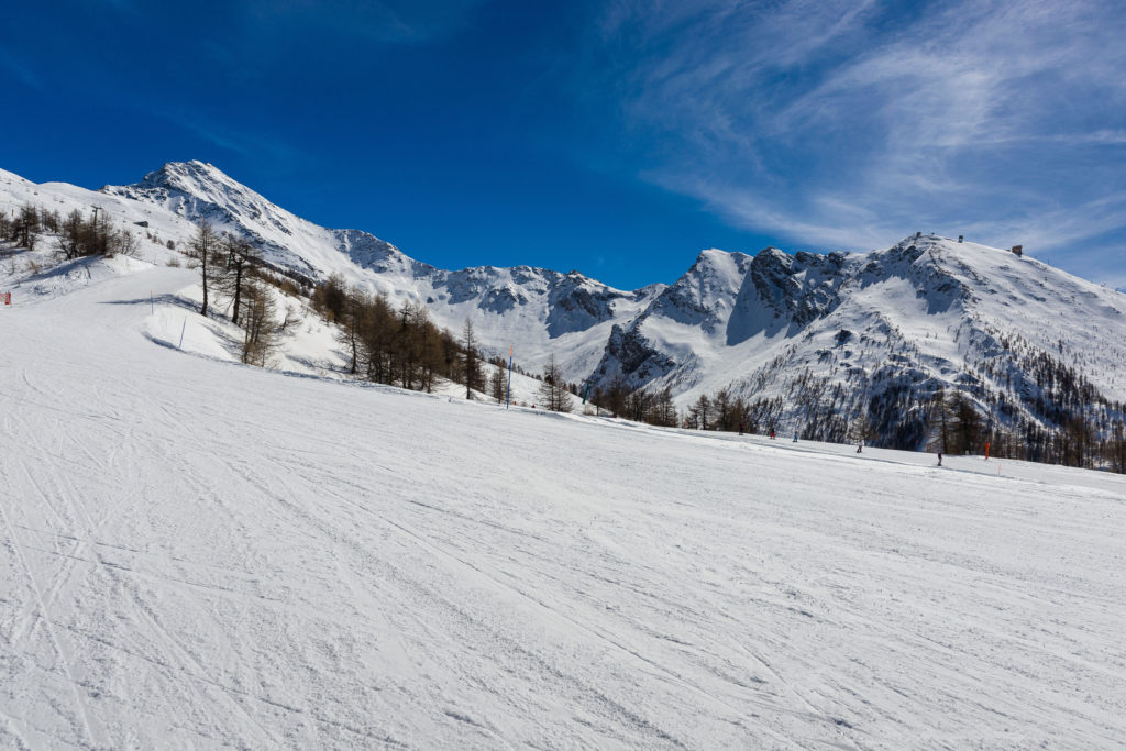 View over the snow-clad slopes of Sestriere in the Milky Way ski resort in Piedmont.