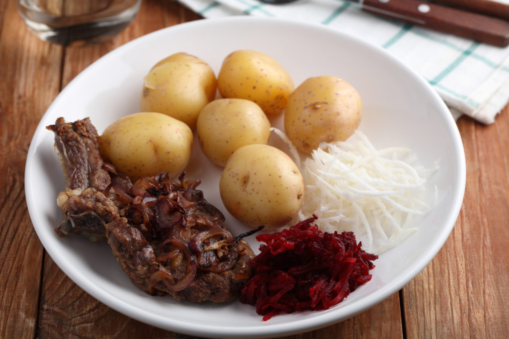 Beef cutlet with boiled potato, beetroot, and daikon radish