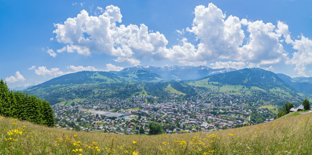 Panoramic view of the mountain village and ski resort of Megeve in the french alps, during summertime.