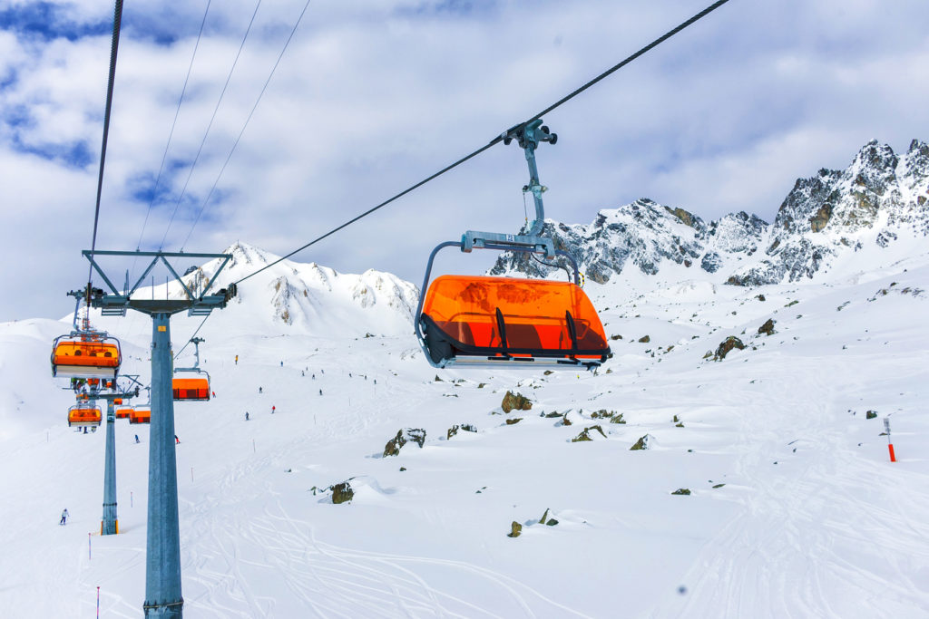 Orange bulbs of chair-lift, Ischgl, Austria Alps.