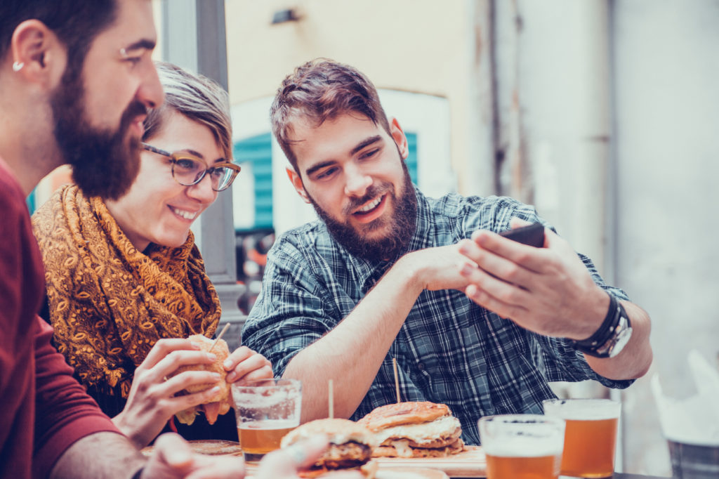 Hipster Friends In Fast Food Rastaurant Taking Selfie