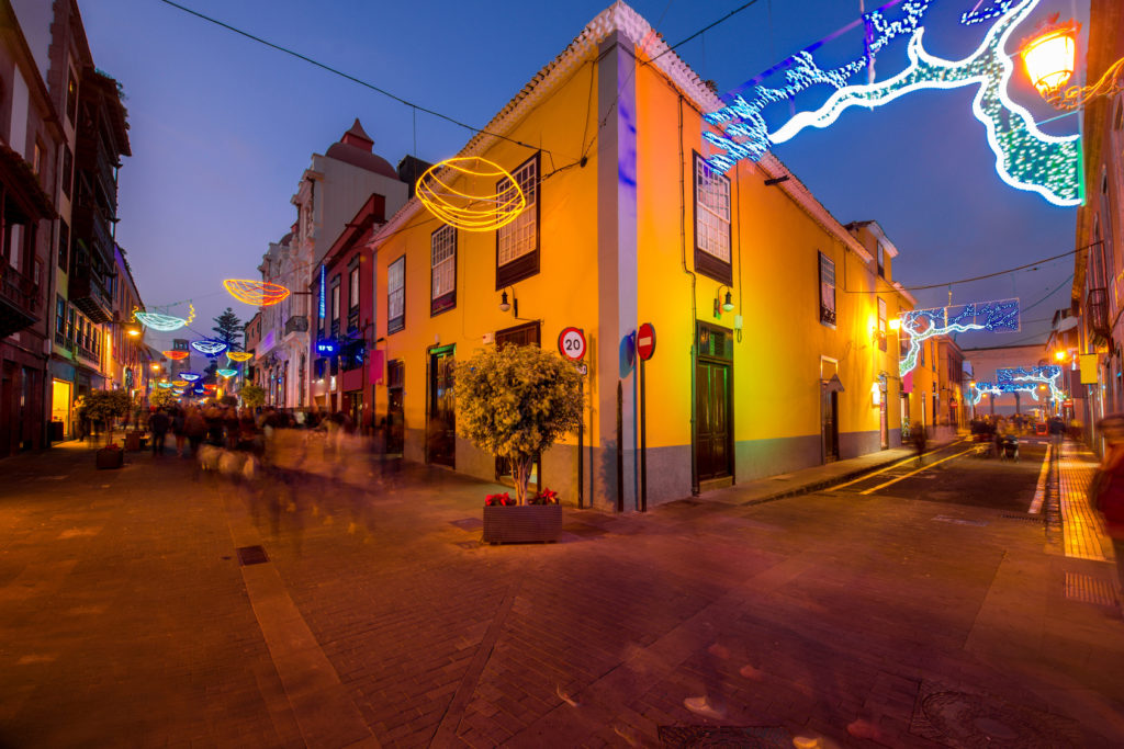 Night street view in La Laguna town with Christmas illuminated decoration and blurred people on Tenerife island in Spain