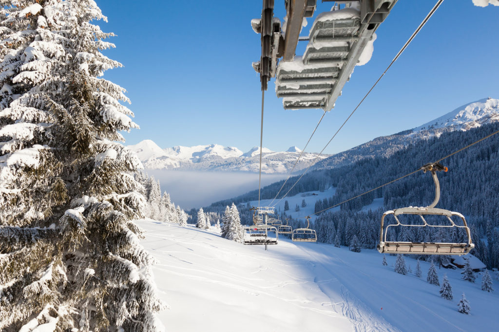 View down the valley from a chair lift in Les Gets ski resort, Portes Du Soleil, France