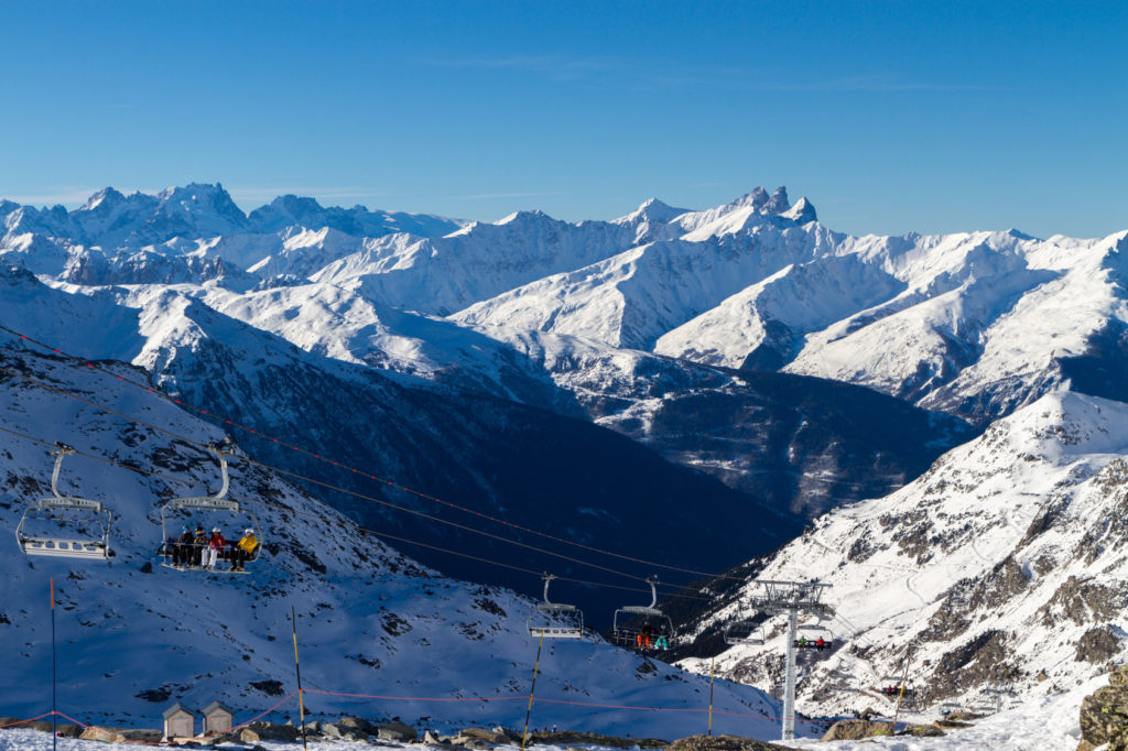 view of the snow-capped mountains , ski slopes , ski lifts, Val Thorens, France