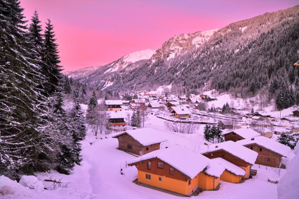 Cityscape of the town of Chatel in the Portes du Soleil in France on a pink morning. HDR