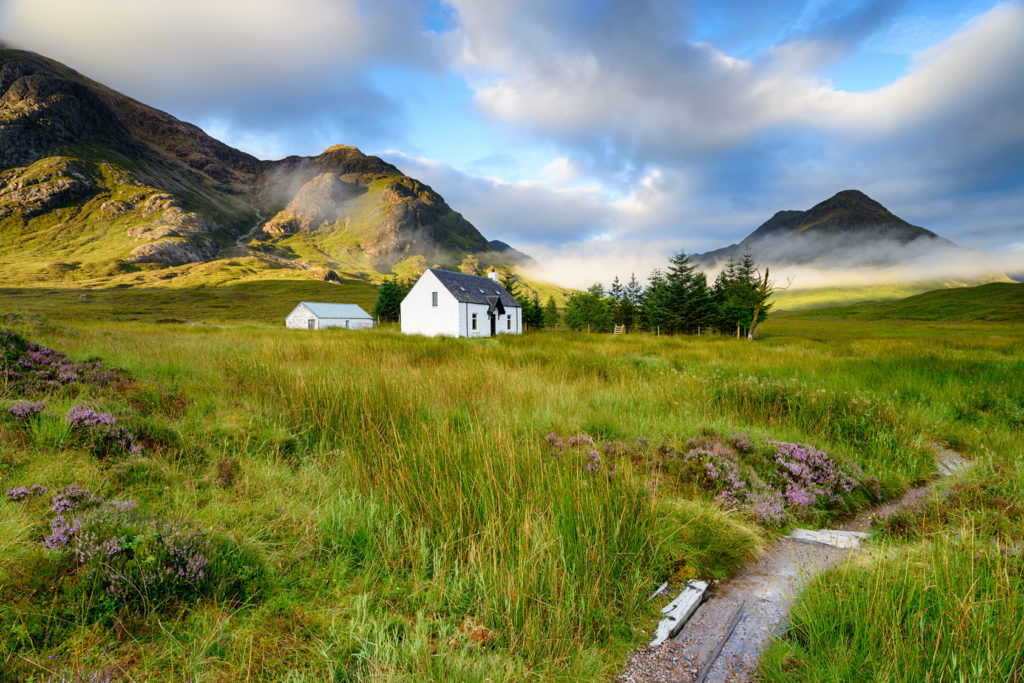 A picture postcard cottage at Glencoe in the Scottish Highlands