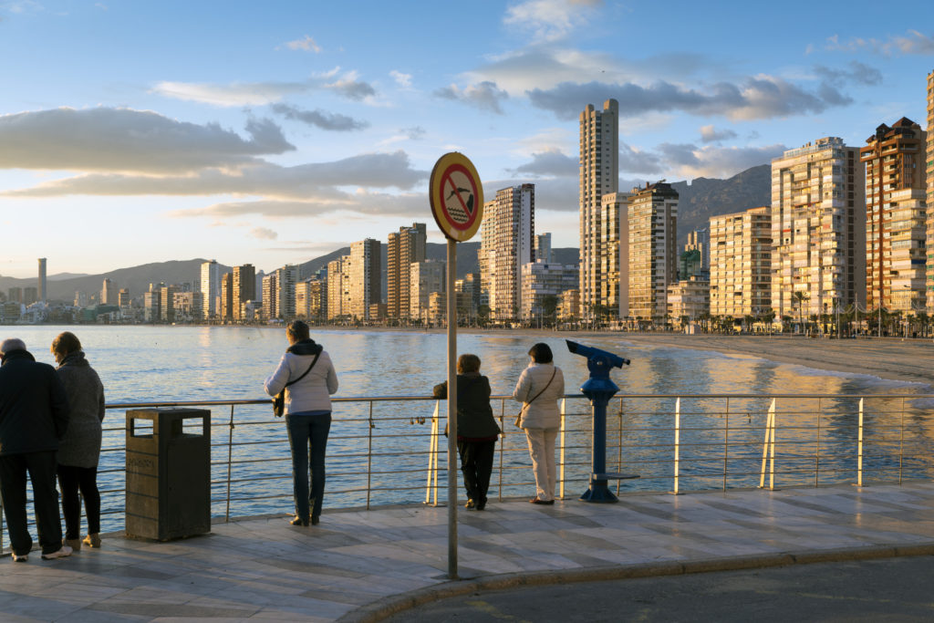 BENIDORM, SPAIN, JANUARY 20, 2015: tourists enjoy a warm winter day from Benidorm's landmark ocean viewpoint. Benidorm is Spain's Nr. 1 beach resort, reputed for its sunny climate all year round.